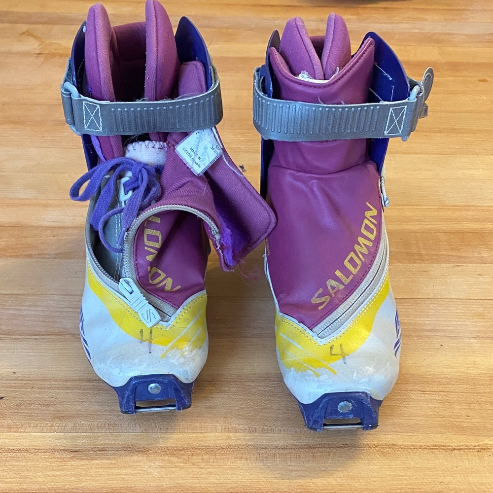 Salomon Purple and Yellow Ski Boots with Gray Straps